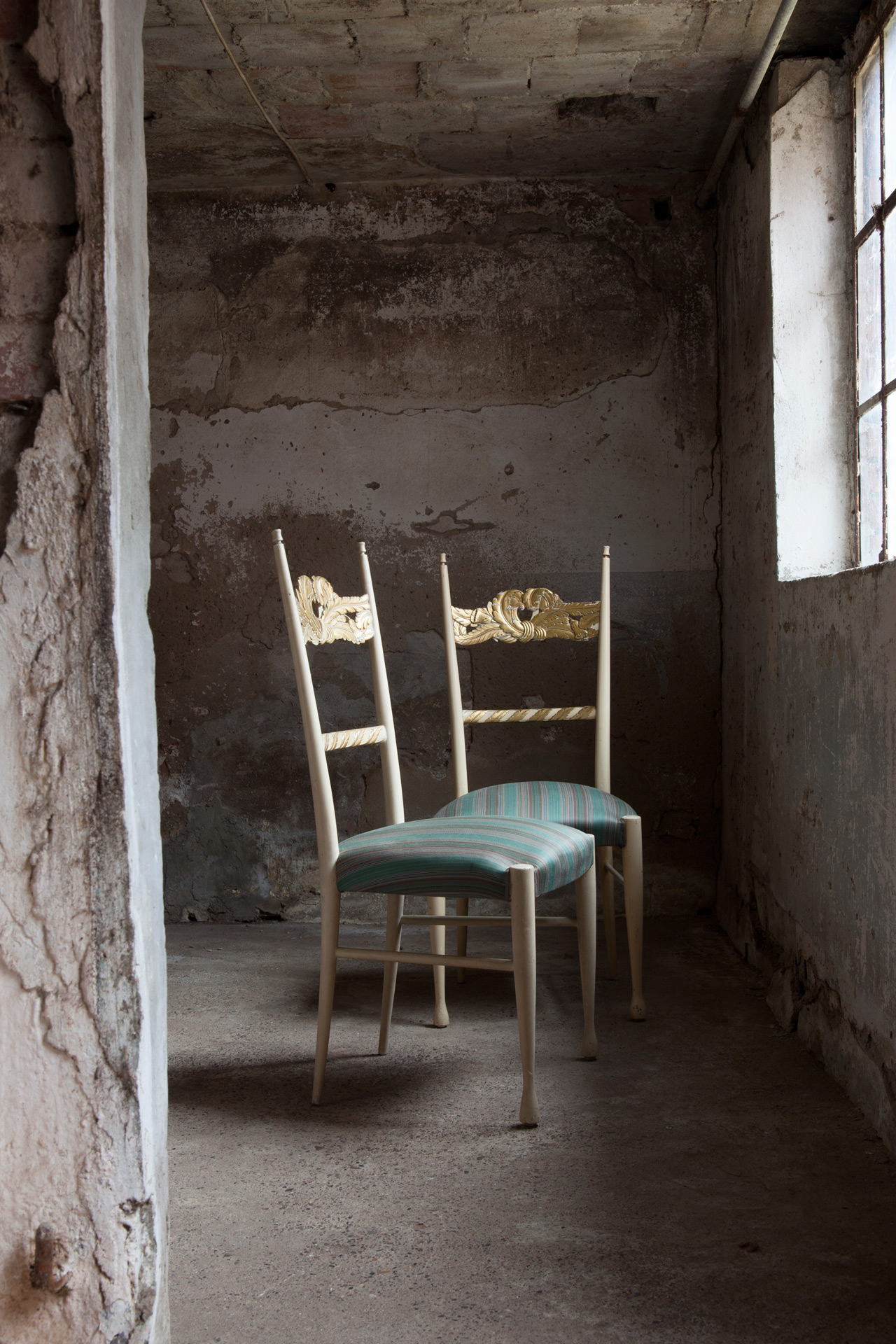 a set of four chairs by Paolo Buffa and Giovanni Gariboldi