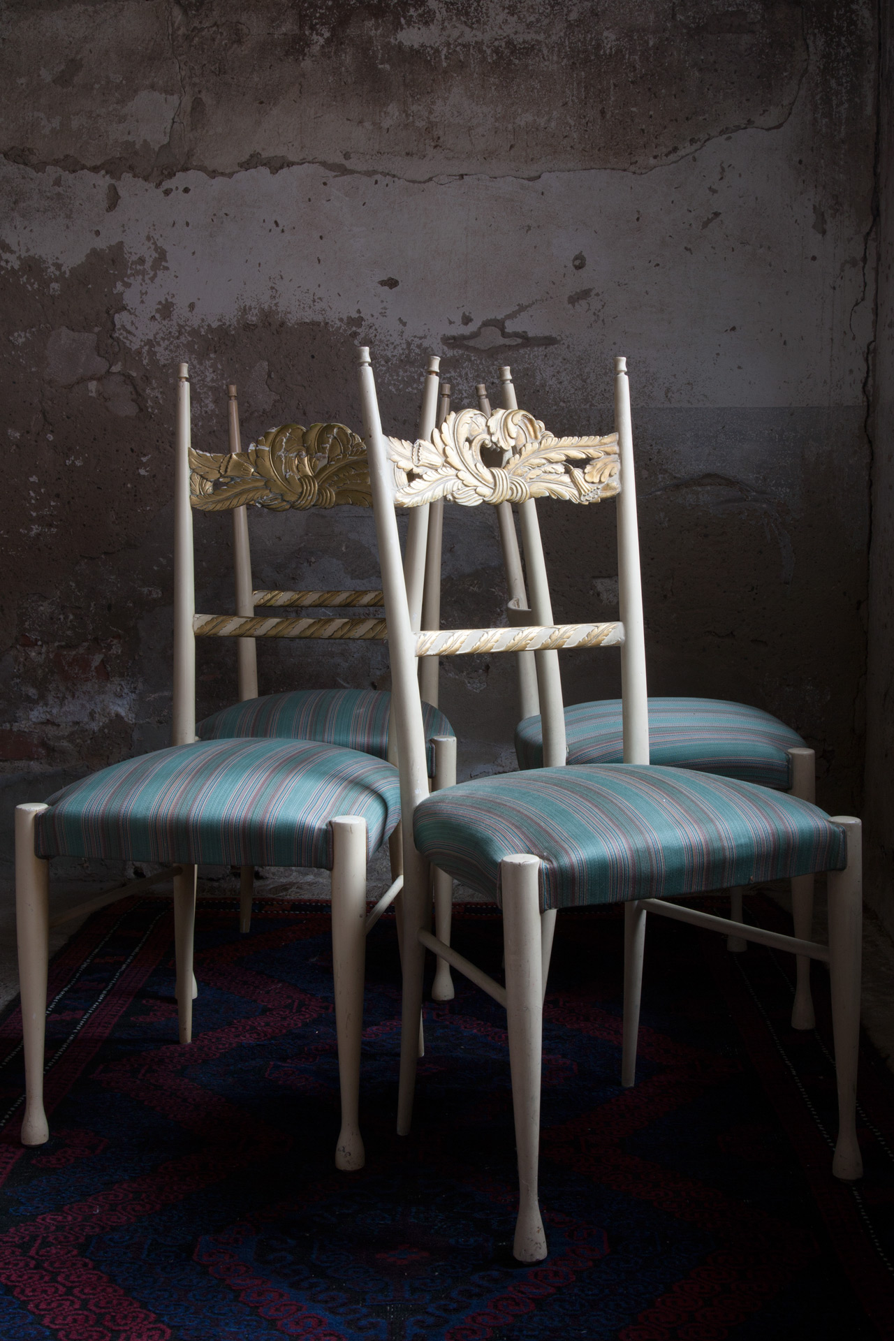 a set of four chairs by Paolo Buffa and Giovanni Gariboldi