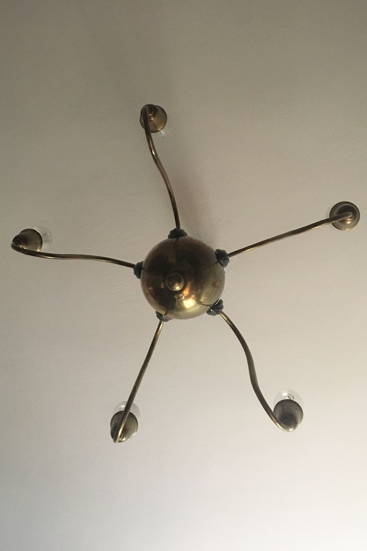 A five-light chandelier by Bruno Paul